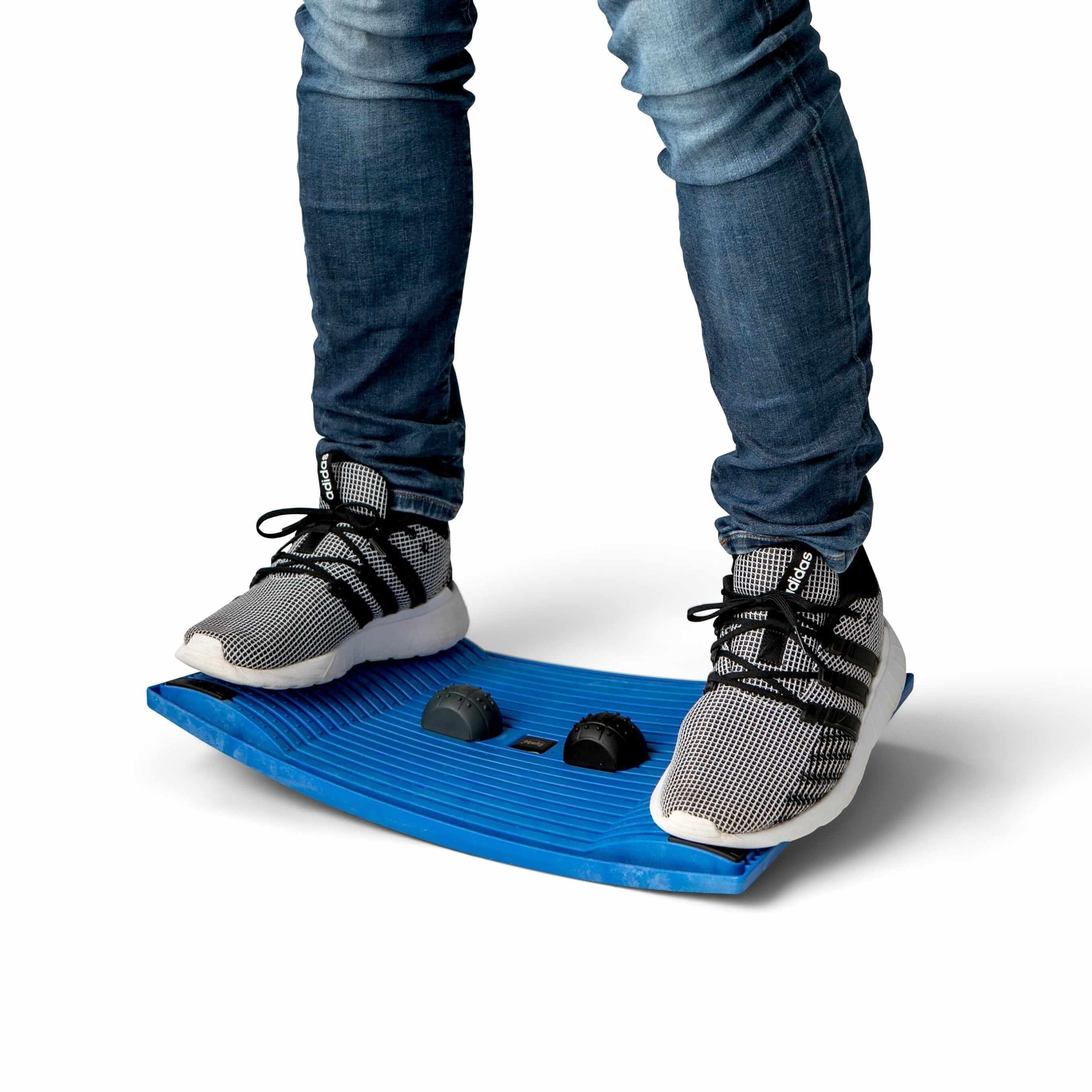 Person standing on a blue Gymba activation board, promoting movement and health in the workplace.