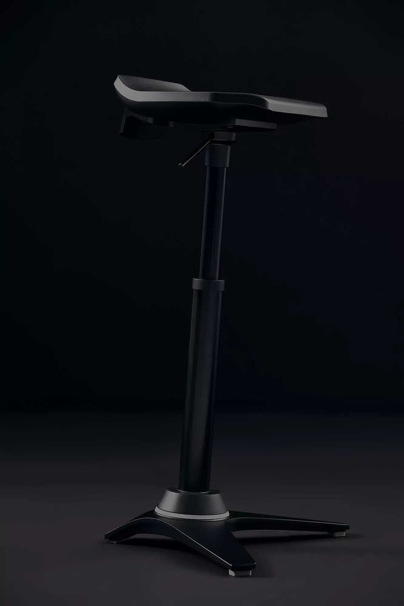 Muvman Industry active chair with high gas spring in black for ergonomic standing support in industrial settings.