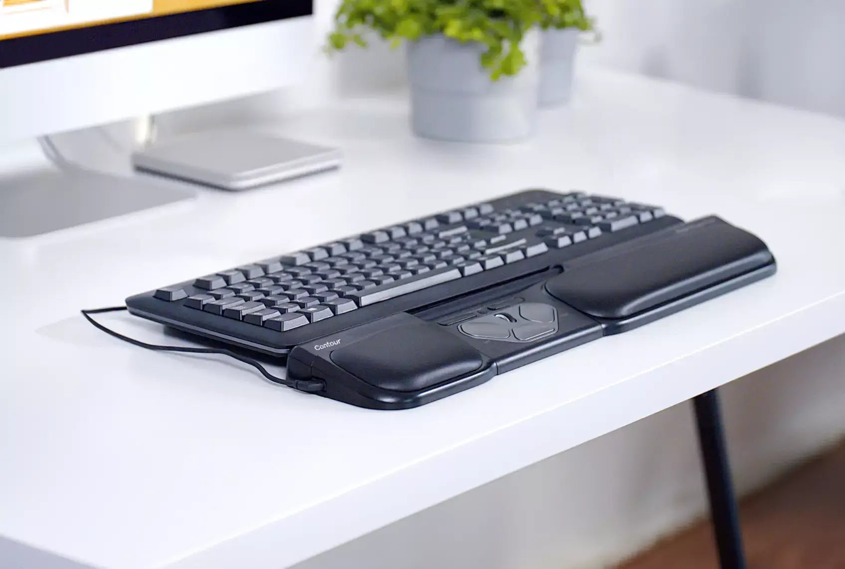 RollerMouse Pro3 wired ergonomic mouse on desk with keyboard, reducing hand strain with light touch rollerbar control.