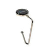 Ergonomic workstation hook for hanging mats or bags on table edges, aiding storage and cleaning.